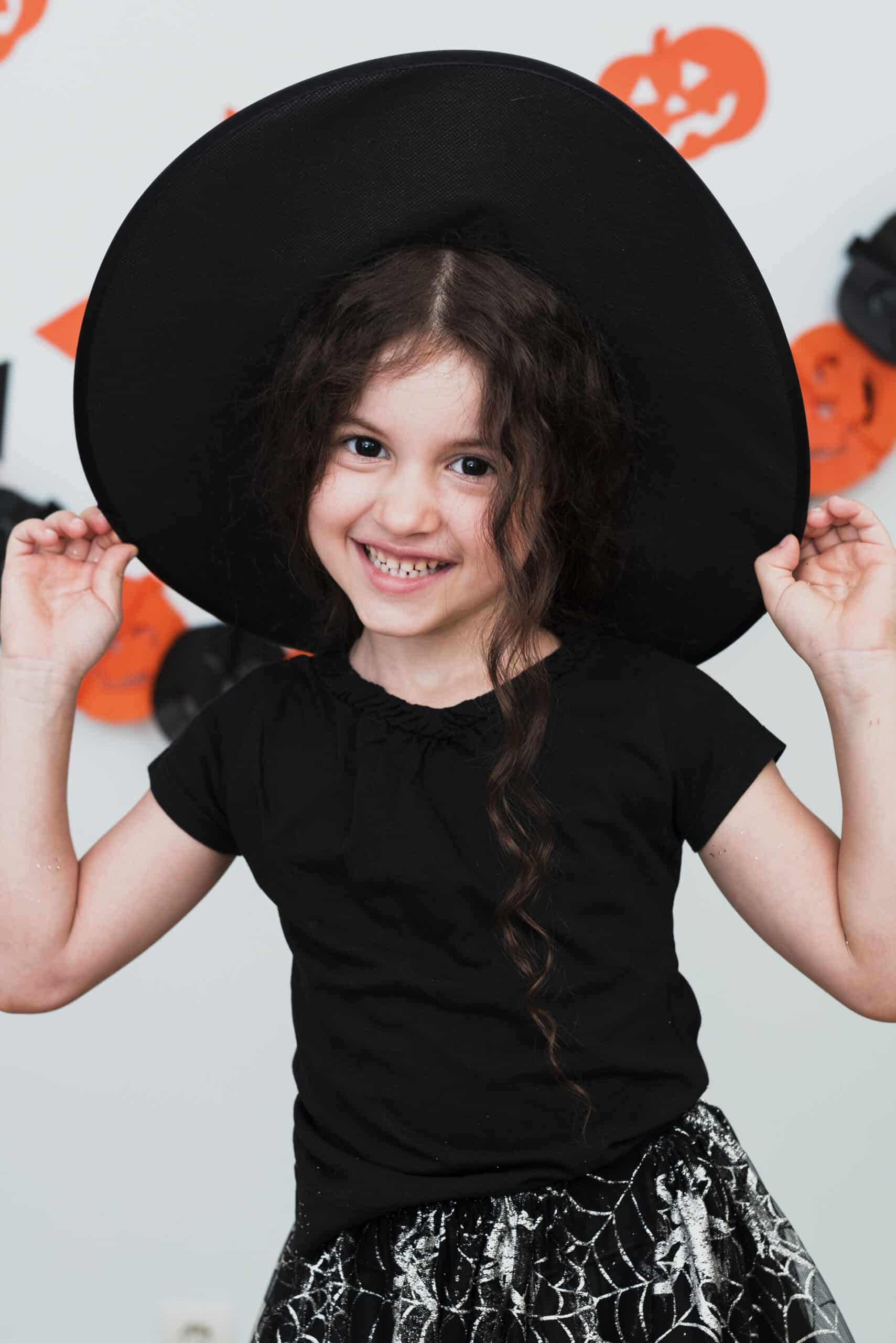 medium shot cute little girl with witch hat scaled Glam Pulse Store